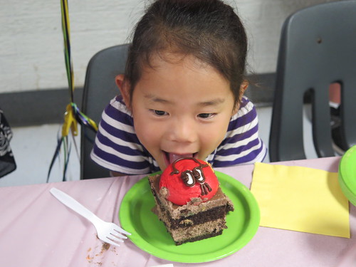 Amelie with her huge piece of cake.
