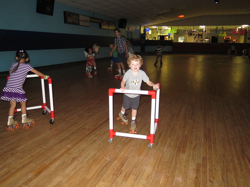 Amelie and Jude using the skate-walkers.