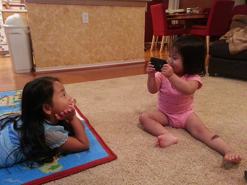 Dani pretending to take a video of Amelie. Dani pretending to take a video of Amelie.